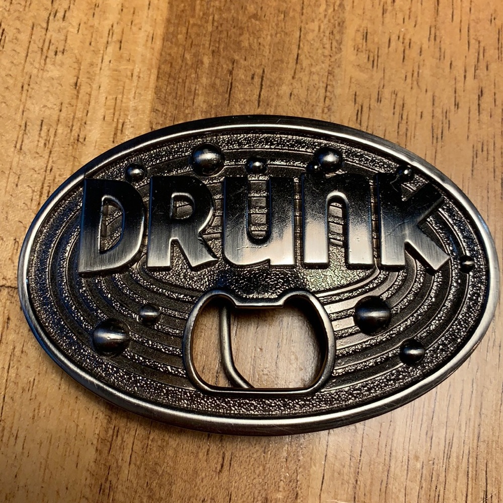Belt buckle with bottle opener